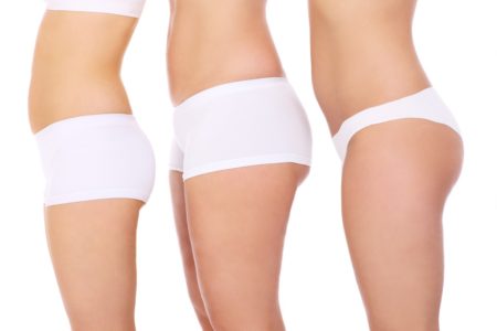 A picture of three diverse but sexy female butts over white background